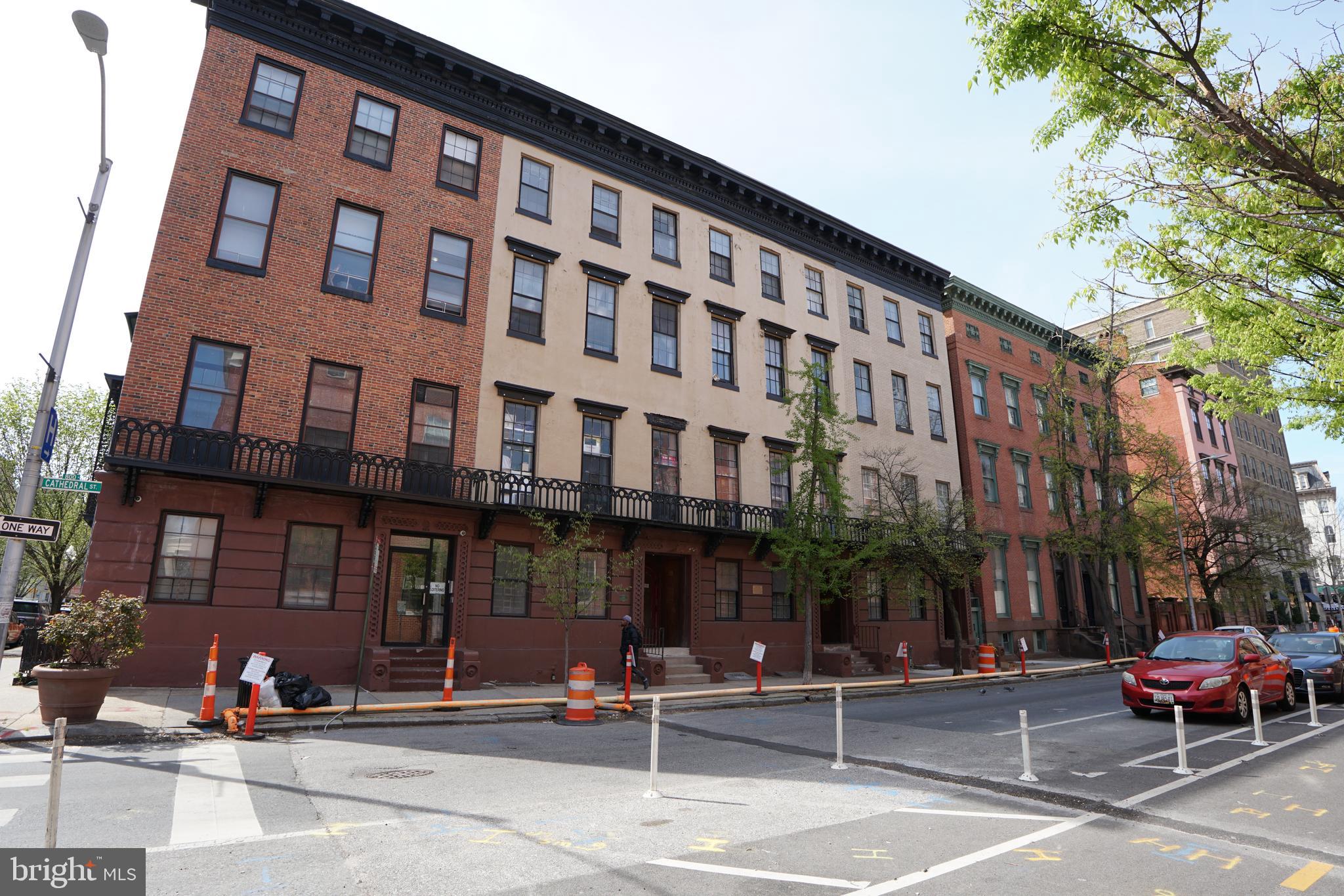 804 Cathedral Street, Unit 7 Baltimore, MD 21201 - Photo 20 of 22 a view of a building with a street