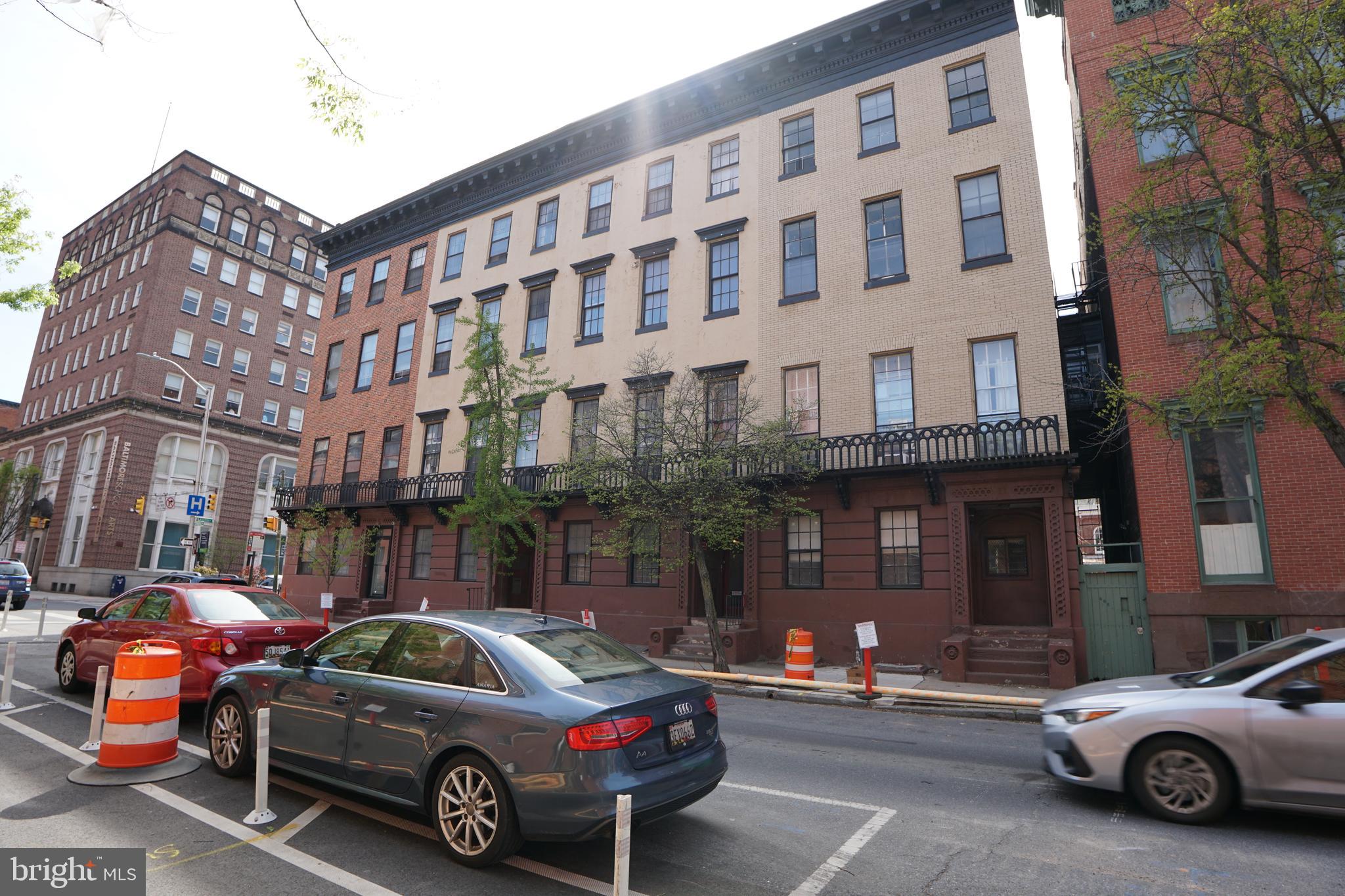 804 Cathedral Street, Unit 7 Baltimore, MD 21201 - Photo 21 of 22 a view of a car parked in front of a building