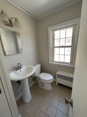 171 Mendon Road Attleboro, MA 02703 - Photo 6 of 11 a bathroom with a sink a toilet and a mirror