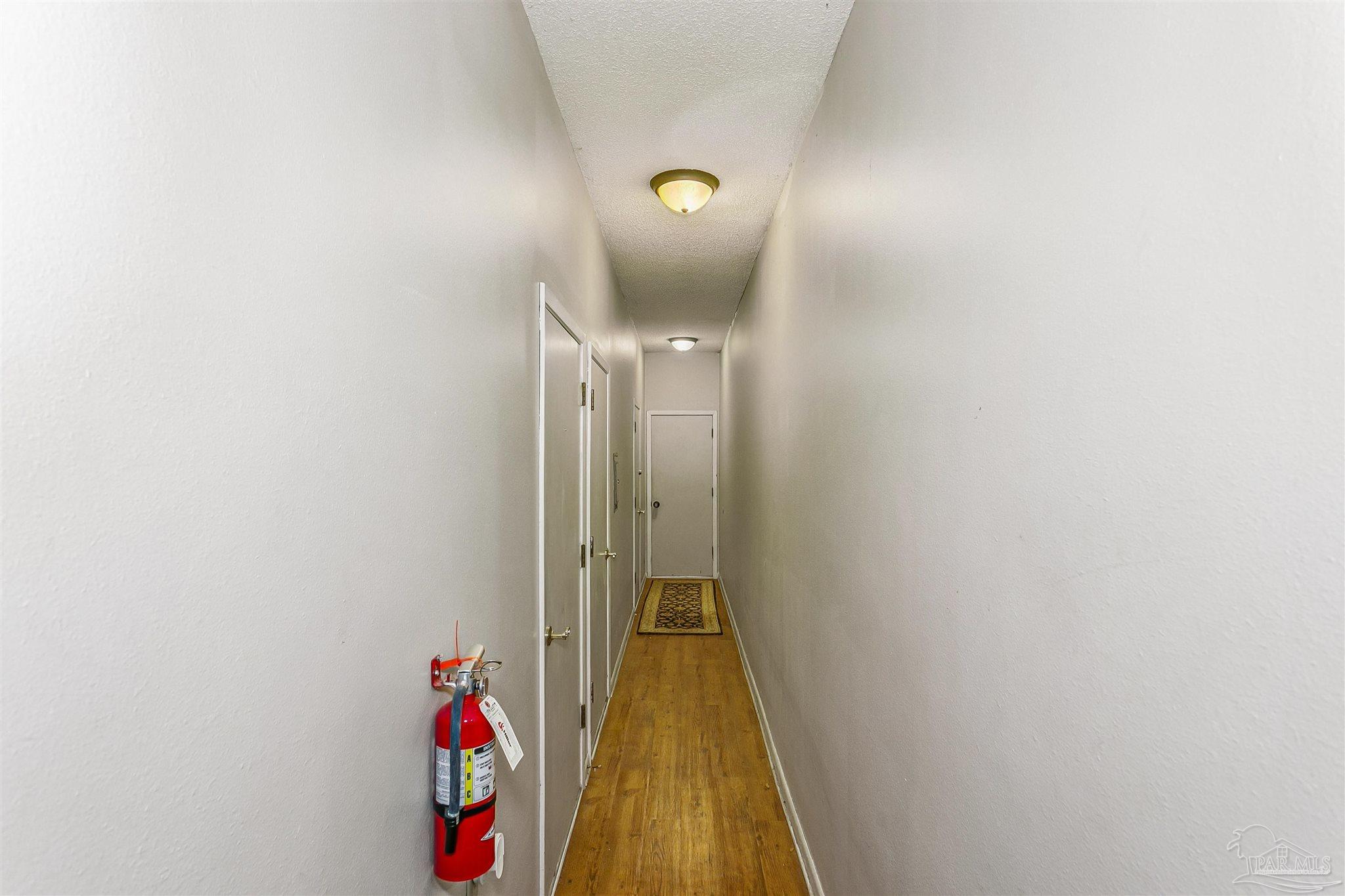 4831 East Olive Road, Unit 2D Pensacola, FL 32514 - Photo 7 of 29 a view of a hallway