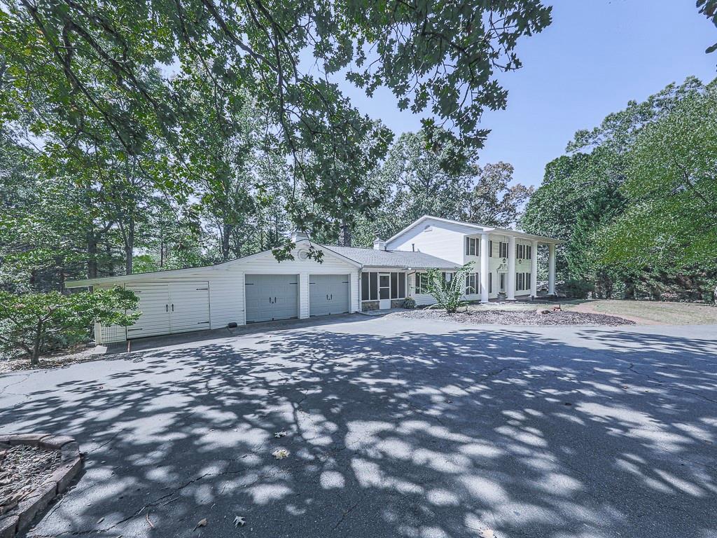 633 Butterworth Road Canton, GA 30114 - Photo 43 of 55 a front view of a house with a garden