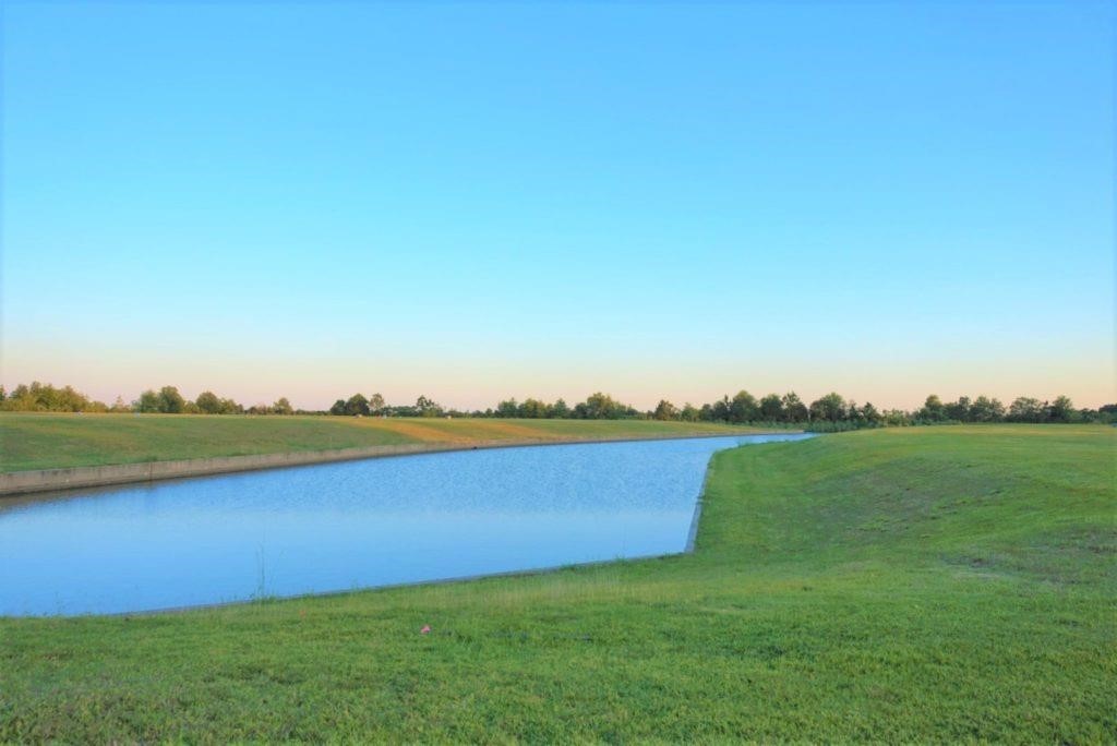 1345 Alice Lane Beaumont, TX 77705 - Photo 4 of 7 a view of a lake with houses in the back