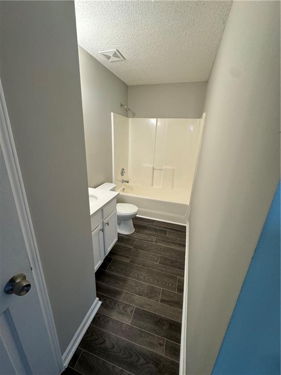 5309 Cattail Lane Atlanta, GA 30349 - Photo 3 of 9 a bathroom with a sink and a toilet