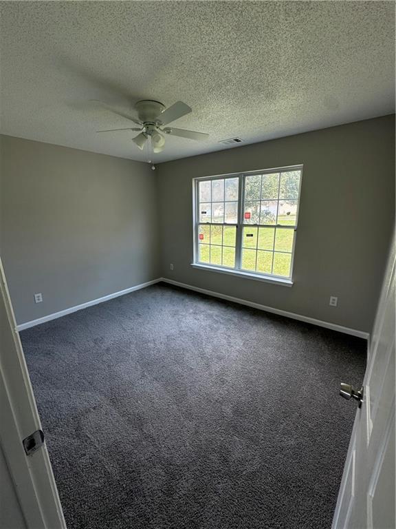 5309 Cattail Lane Atlanta, GA 30349 - Photo 5 of 9 an empty room with a empty space and windows