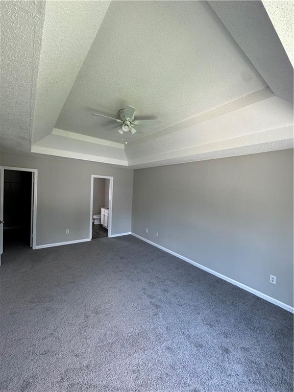 5309 Cattail Lane Atlanta, GA 30349 - Photo 6 of 9 a view of an empty room with a chandelier fan