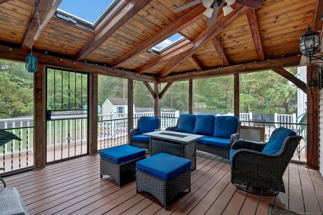 a outdoor living space with furniture and wooden floor