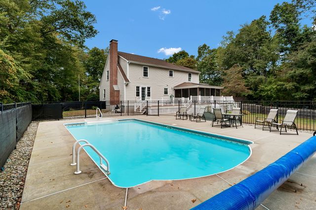 a view of a swimming pool with a patio