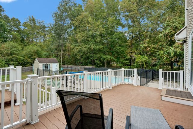 a view of a chair and table in the deck