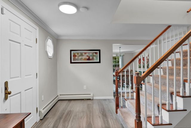 a view of entryway with wooden floor