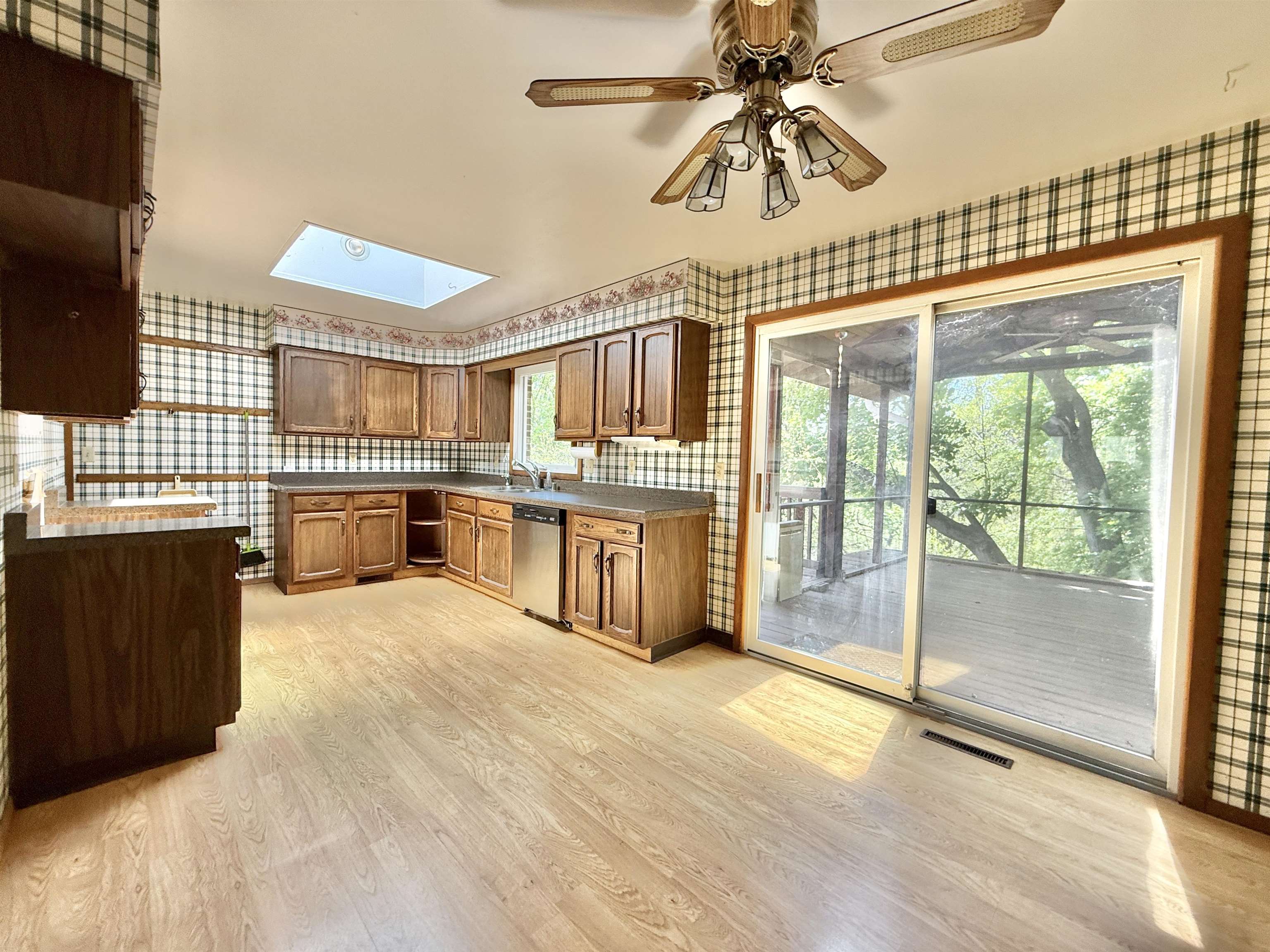 3620 Valerie Road Roscoe, IL 61073 - Photo 7 of 26 a large kitchen with stainless steel appliances granite countertop a stove and cabinets
