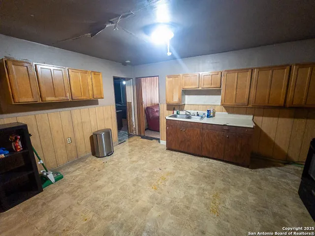 a view of a kitchen with furniture and a window