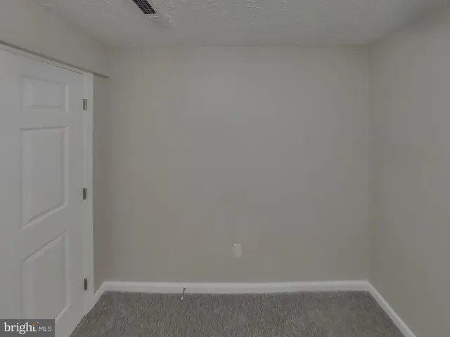 a view of balcony with wooden floor and outdoor seating