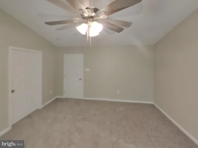 a bathroom with double vanity sink and a mirror