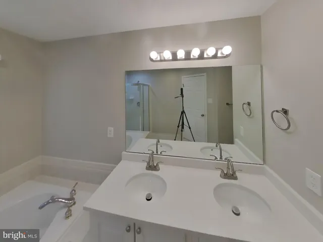 a bathroom with a bathtub and shower