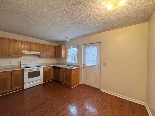 7236 Old Harding Pike Nashville, TN 37221 - Photo 3 of 5 a large kitchen with a stove a sink dishwasher and a refrigerator with wooden floor