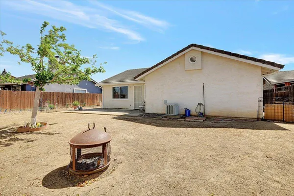 a view of a backyard of the house