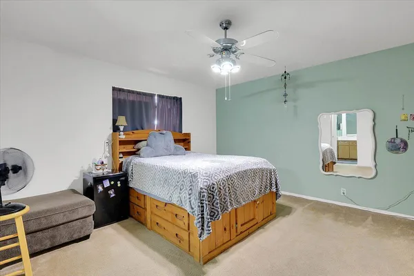 a bedroom with a bed and window