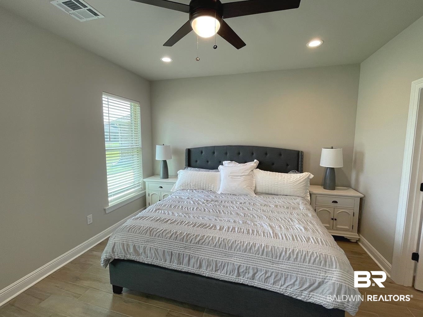 9961 Chipper Lane Foley, AL 36535 - Photo 9 of 16 Bedroom featuring hardwood / wood-style flooring and ceiling fan