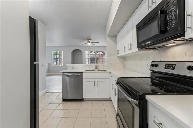 a kitchen with a stove and a microwave