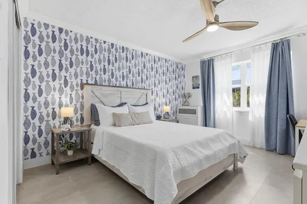 a bedroom with a bed bed and a window