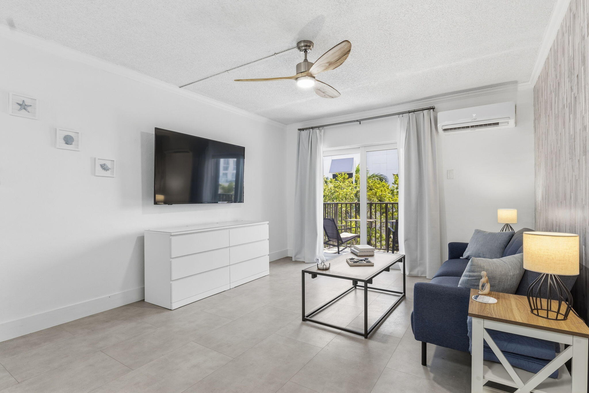 3000 Riomar Street, Unit 407 Fort Lauderdale, FL 33304 - Photo 14 of 38 a living room with furniture and a flat screen tv