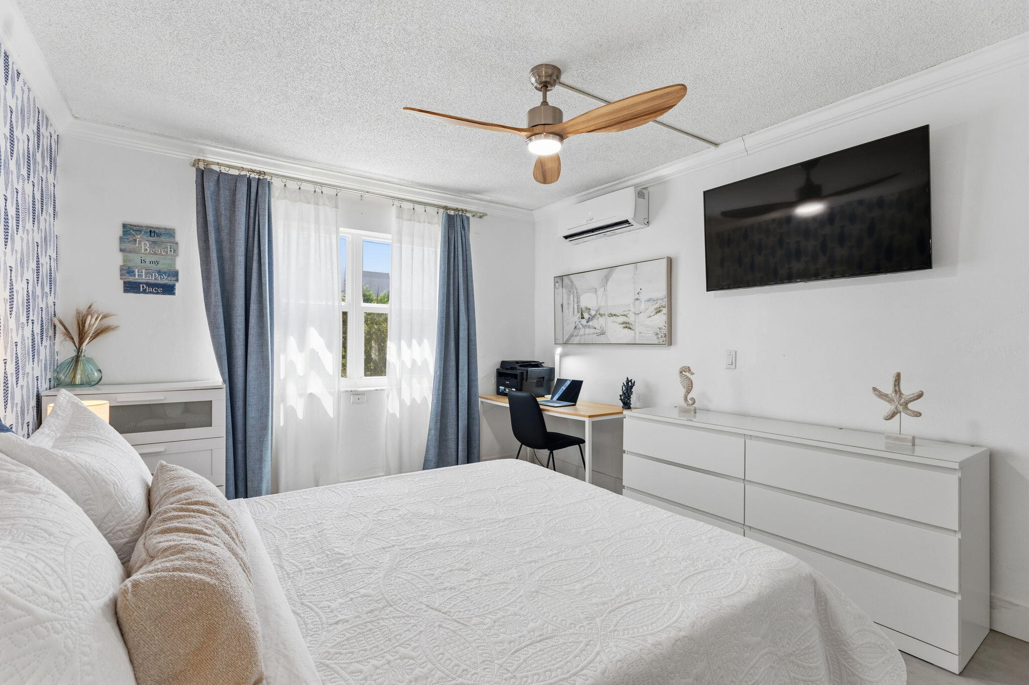 3000 Riomar Street, Unit 407 Fort Lauderdale, FL 33304 - Photo 19 of 38 a bedroom with a large bed and a flat screen tv