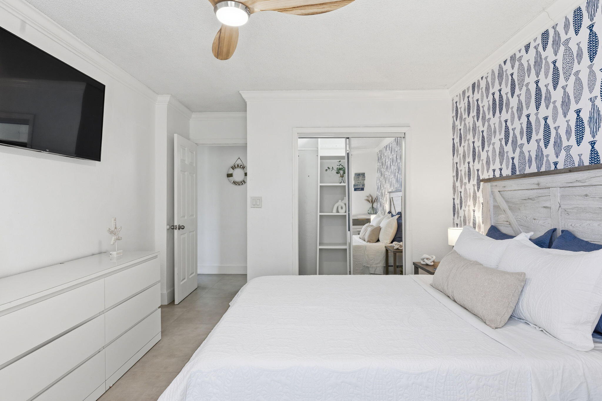 3000 Riomar Street, Unit 407 Fort Lauderdale, FL 33304 - Photo 20 of 38 a bedroom with a bed and a flat screen tv