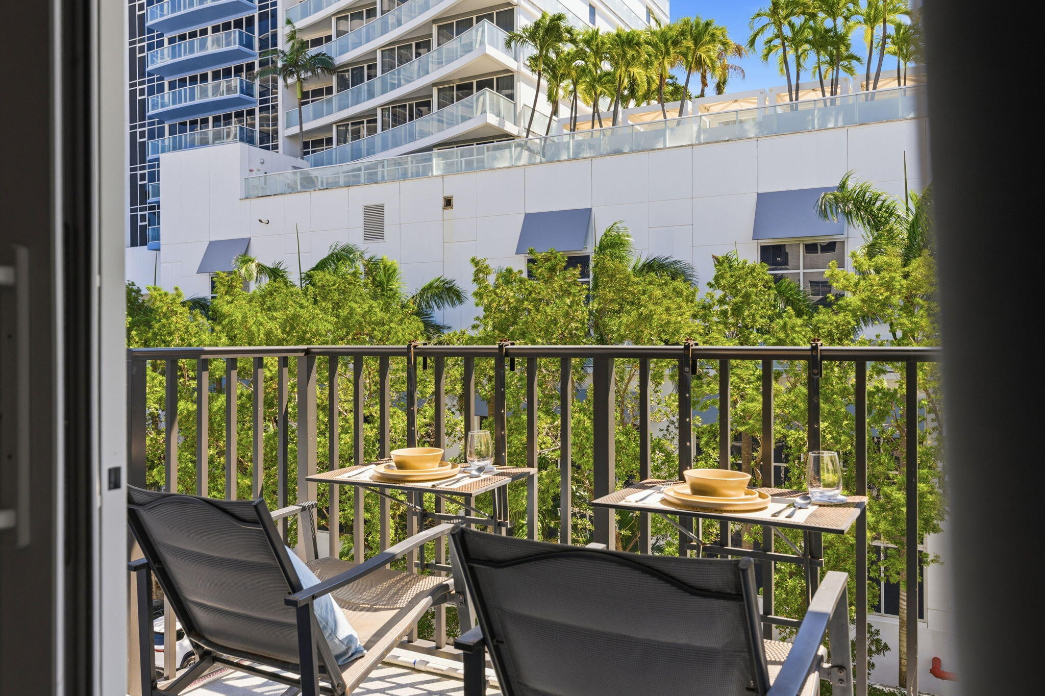 3000 Riomar Street, Unit 407 Fort Lauderdale, FL 33304 - Photo 23 of 38 a view from a balcony with chairs
