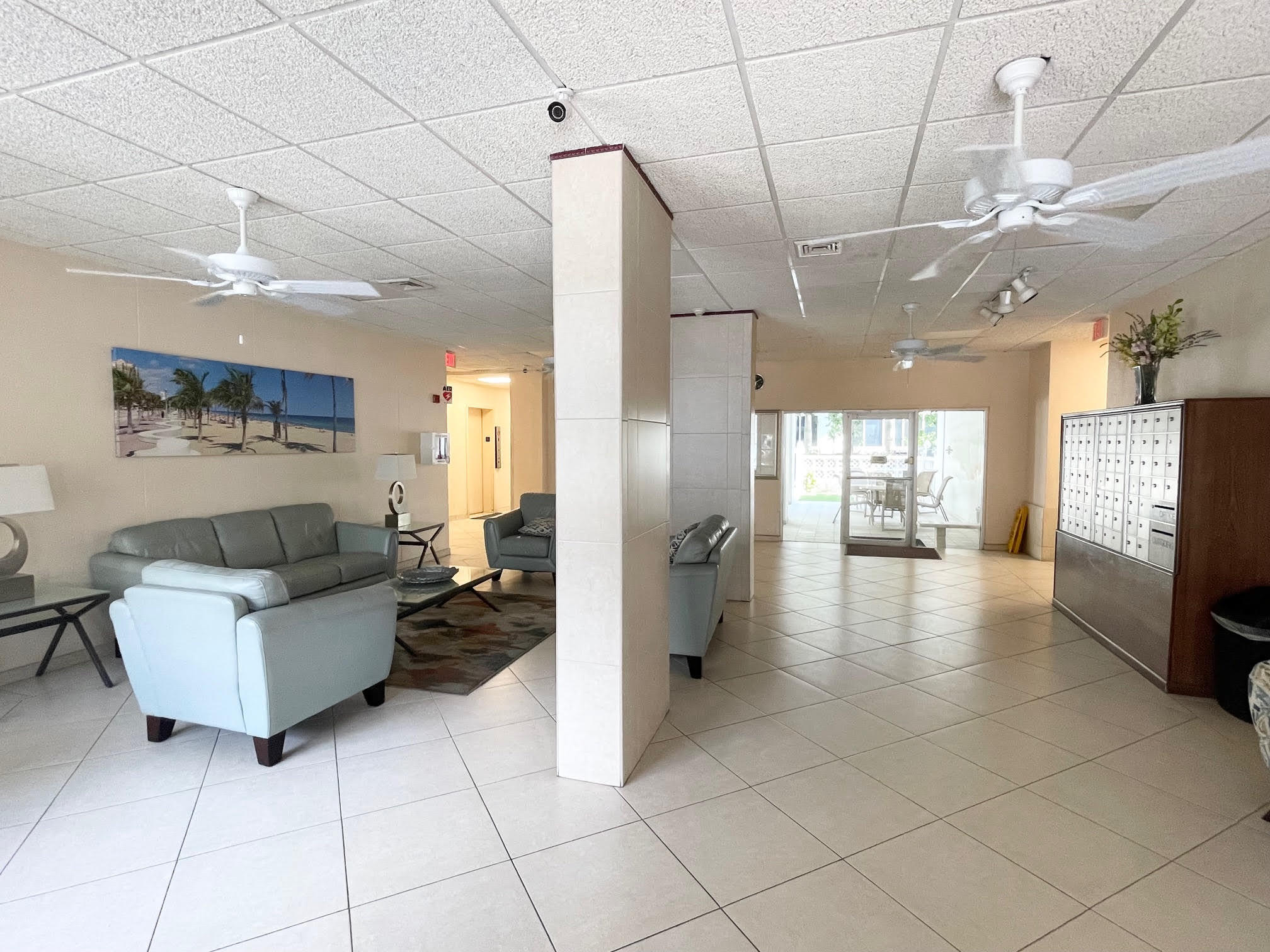 3000 Riomar Street, Unit 407 Fort Lauderdale, FL 33304 - Photo 27 of 38 a living room with couches and kitchen view