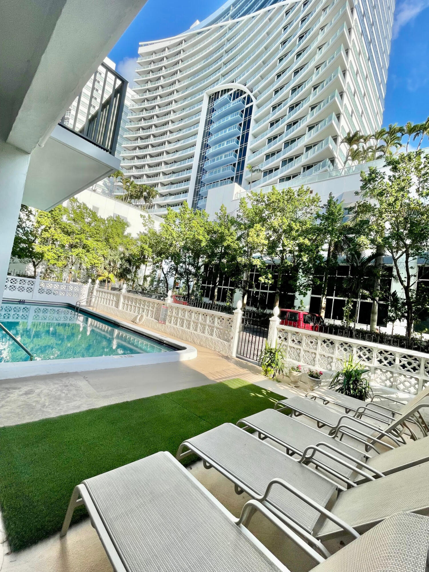 3000 Riomar Street, Unit 407 Fort Lauderdale, FL 33304 - Photo 30 of 38 a view of a swimming pool with a patio