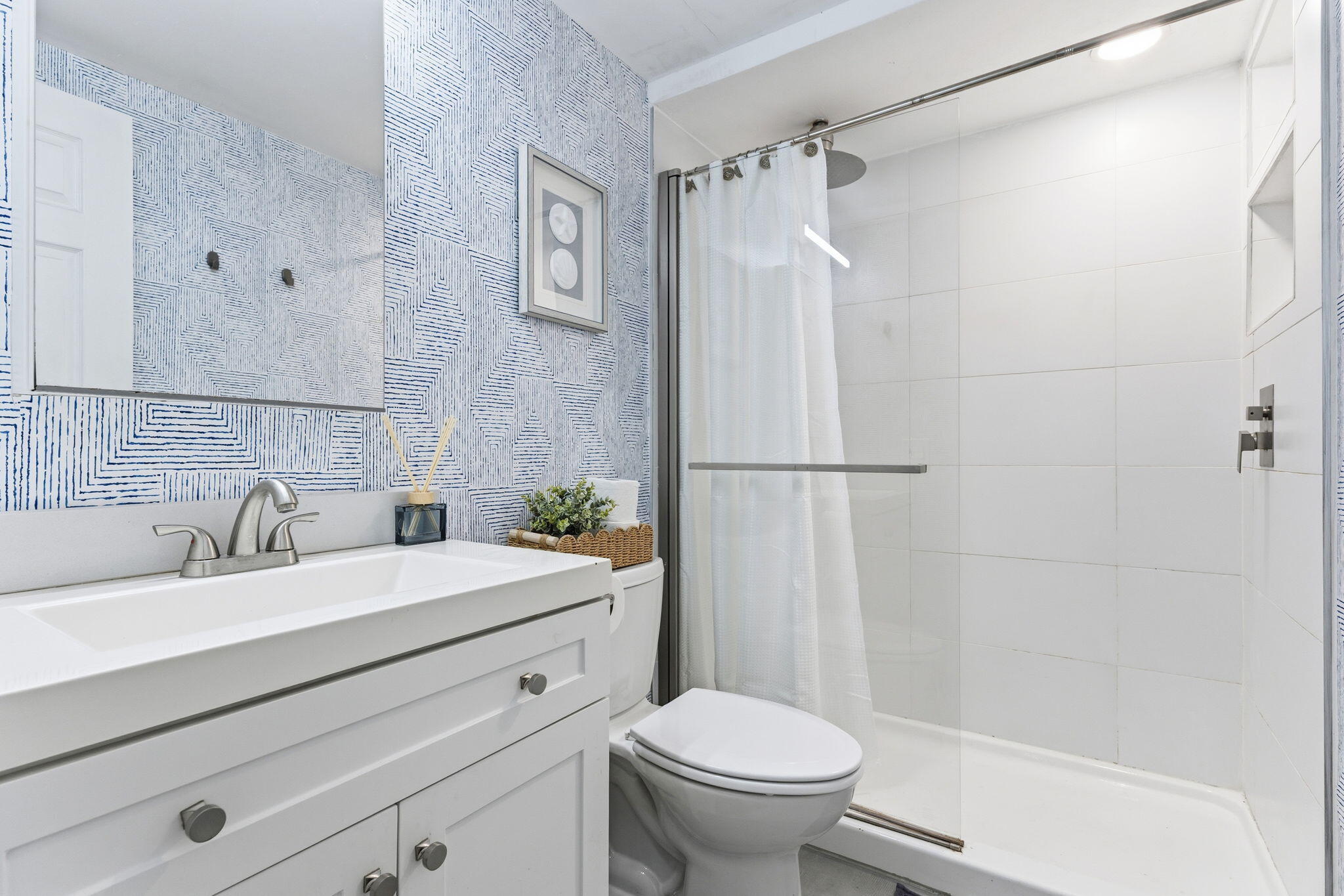 3000 Riomar Street, Unit 407 Fort Lauderdale, FL 33304 - Photo 3 of 38 a bathroom with a sink toilet and shower