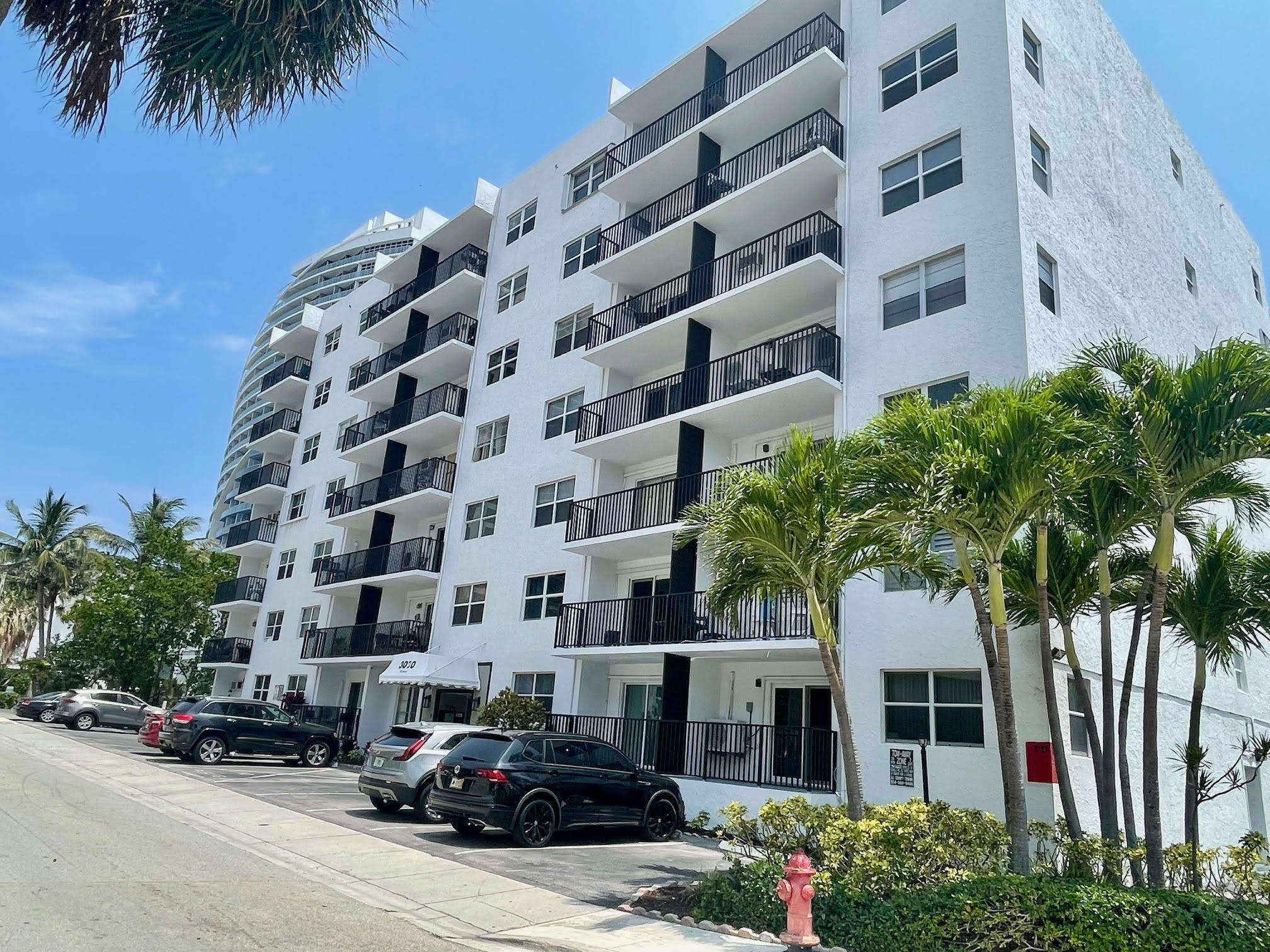 3000 Riomar Street, Unit 407 Fort Lauderdale, FL 33304 - Photo 31 of 38 front view of a building with a garden and parking space