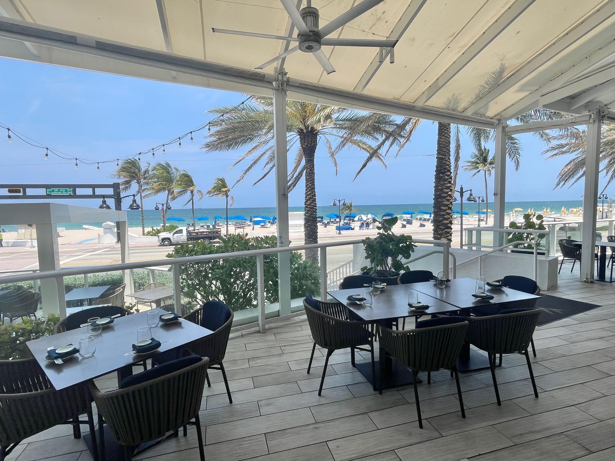 3000 Riomar Street, Unit 407 Fort Lauderdale, FL 33304 - Photo 36 of 38 a view of a tables and chairs in patio
