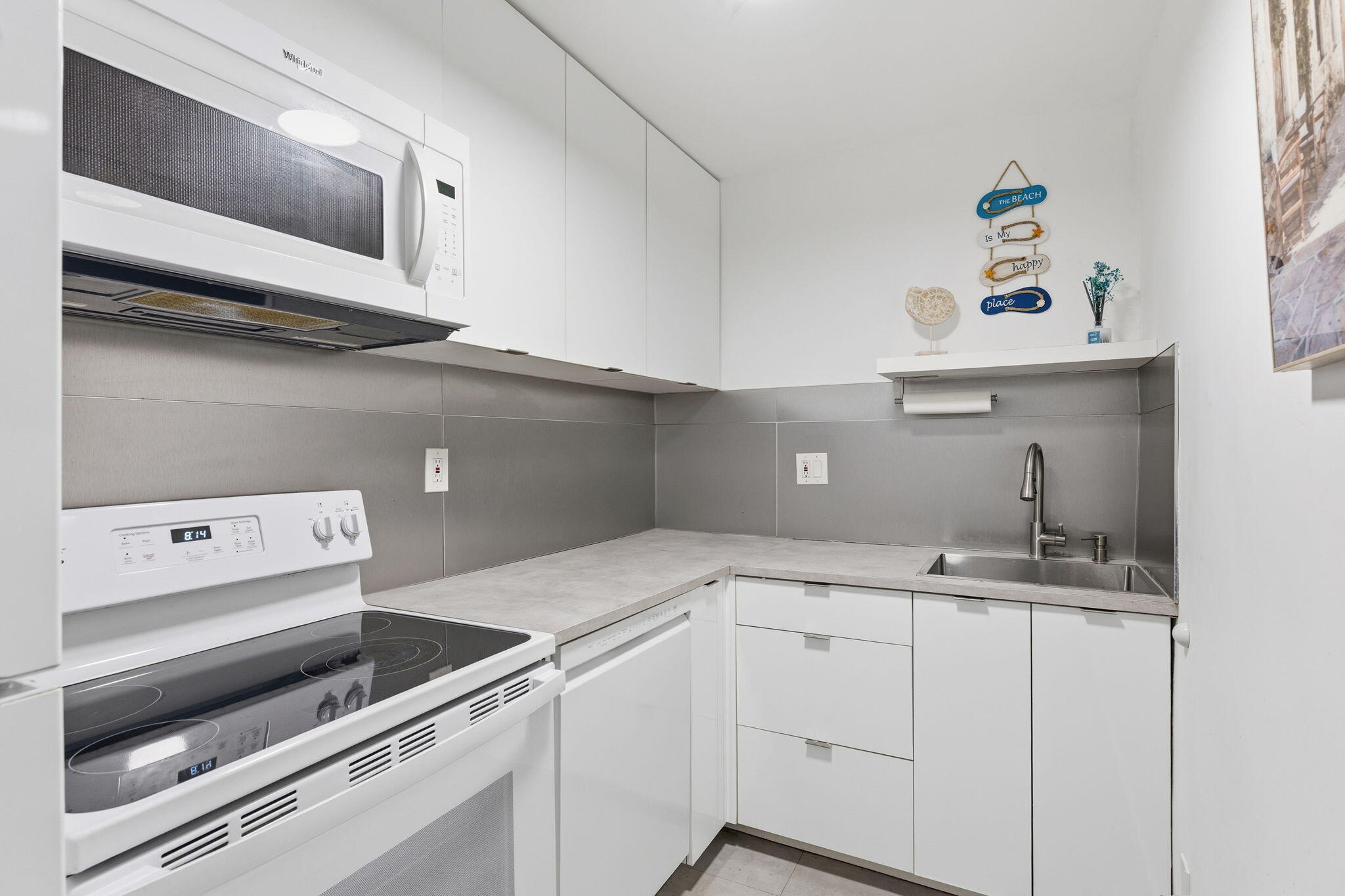 3000 Riomar Street, Unit 407 Fort Lauderdale, FL 33304 - Photo 5 of 38 a kitchen with a sink and cabinets