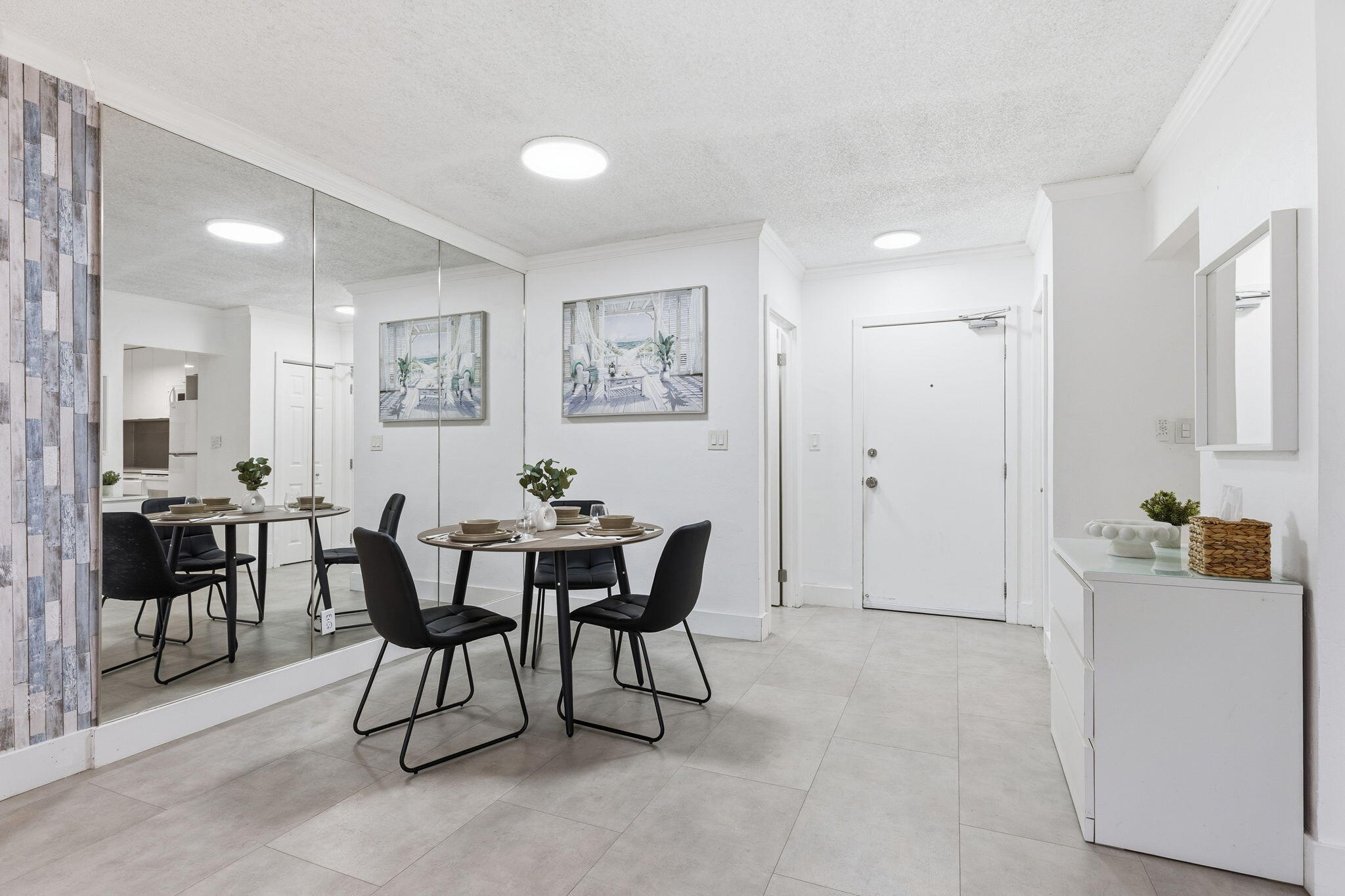 3000 Riomar Street, Unit 407 Fort Lauderdale, FL 33304 - Photo 9 of 38 a view of a dining room with furniture and chandelier