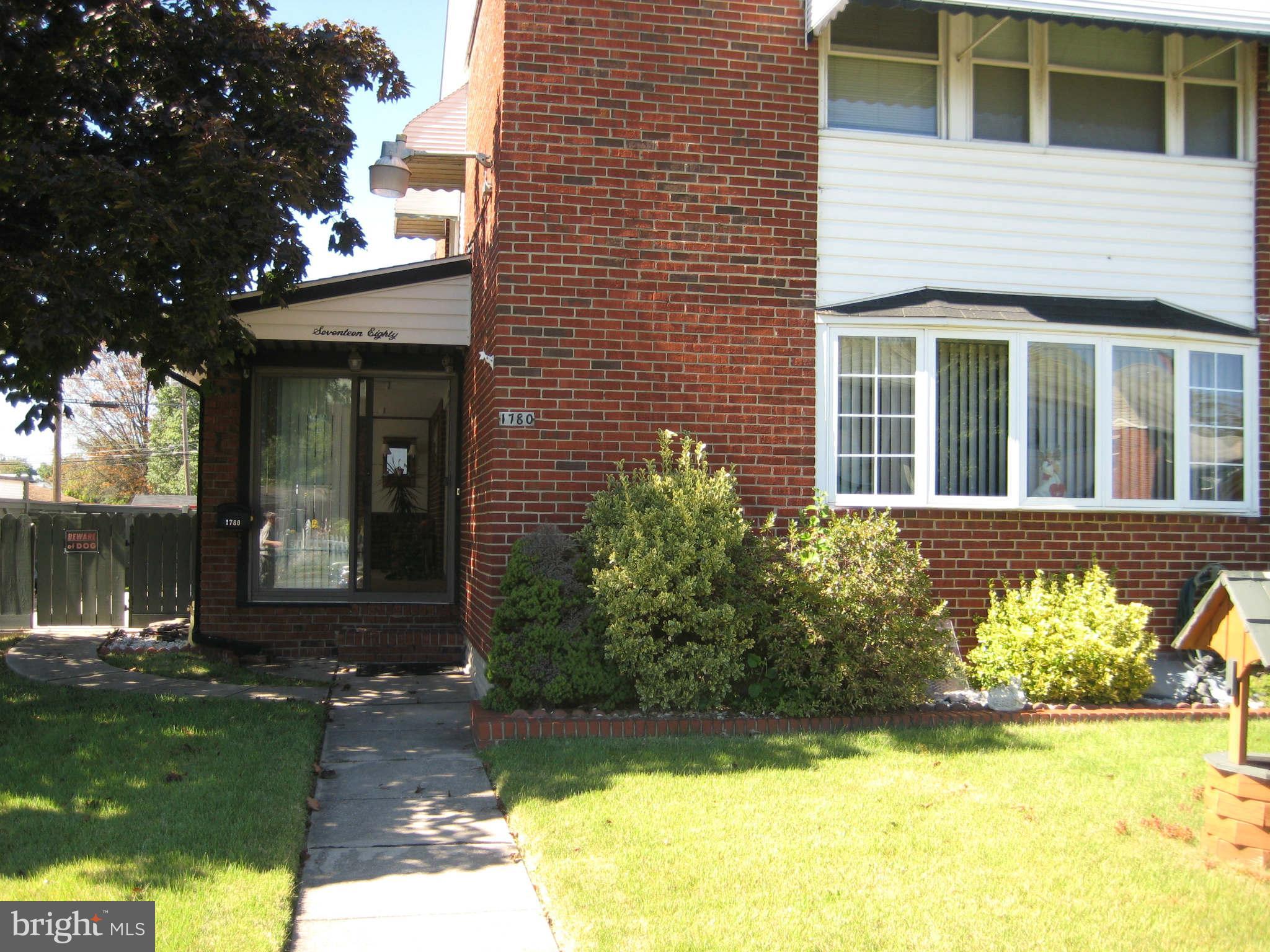 1780 Melbourne Road Baltimore, MD 21222 - Photo 2 of 25 a view of a brick house with a yard