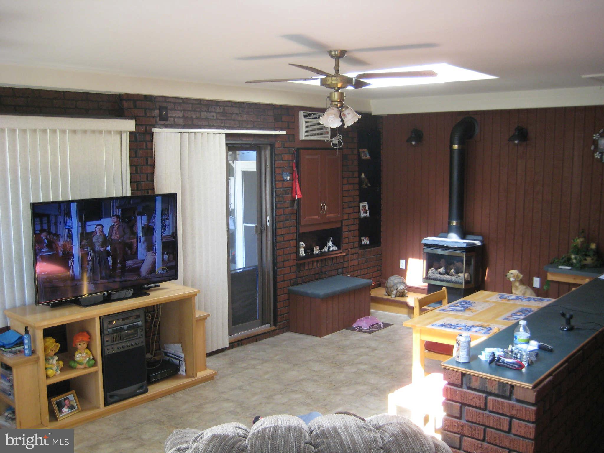 1780 Melbourne Road Baltimore, MD 21222 - Photo 16 of 25 a living room with furniture and a flat screen tv
