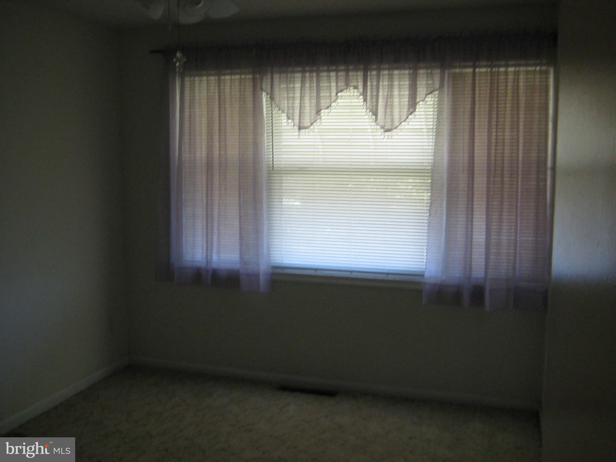1780 Melbourne Road Baltimore, MD 21222 - Photo 21 of 25 a room that has a window in it
