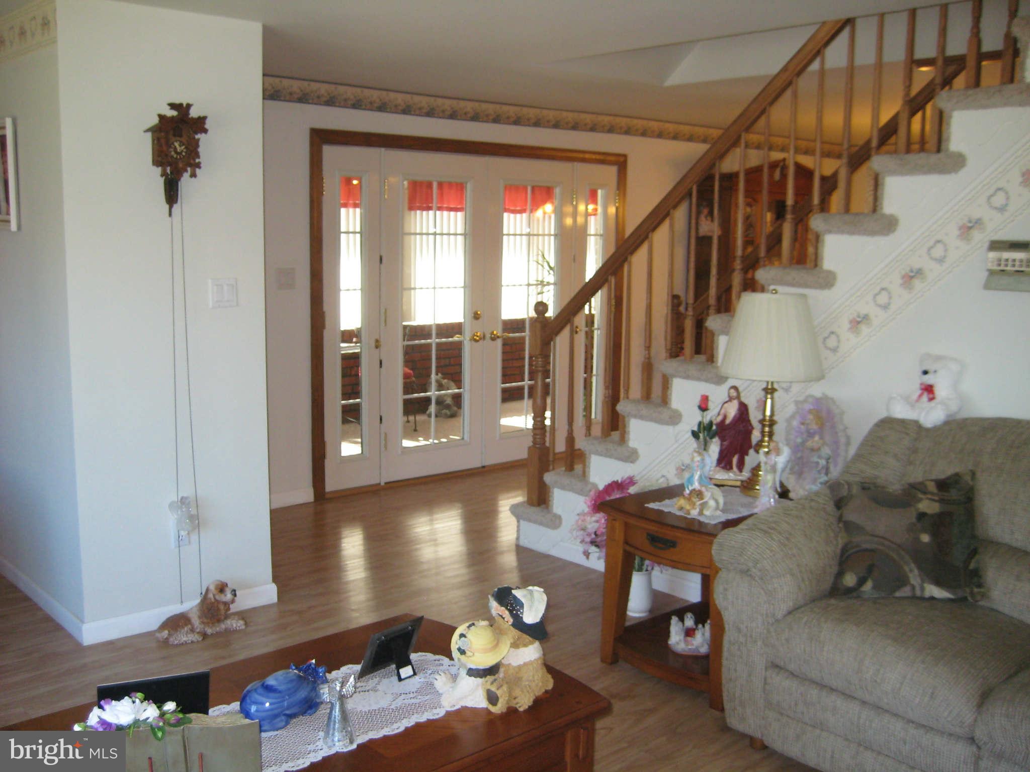 1780 Melbourne Road Baltimore, MD 21222 - Photo 7 of 25 a living room with furniture and stairs