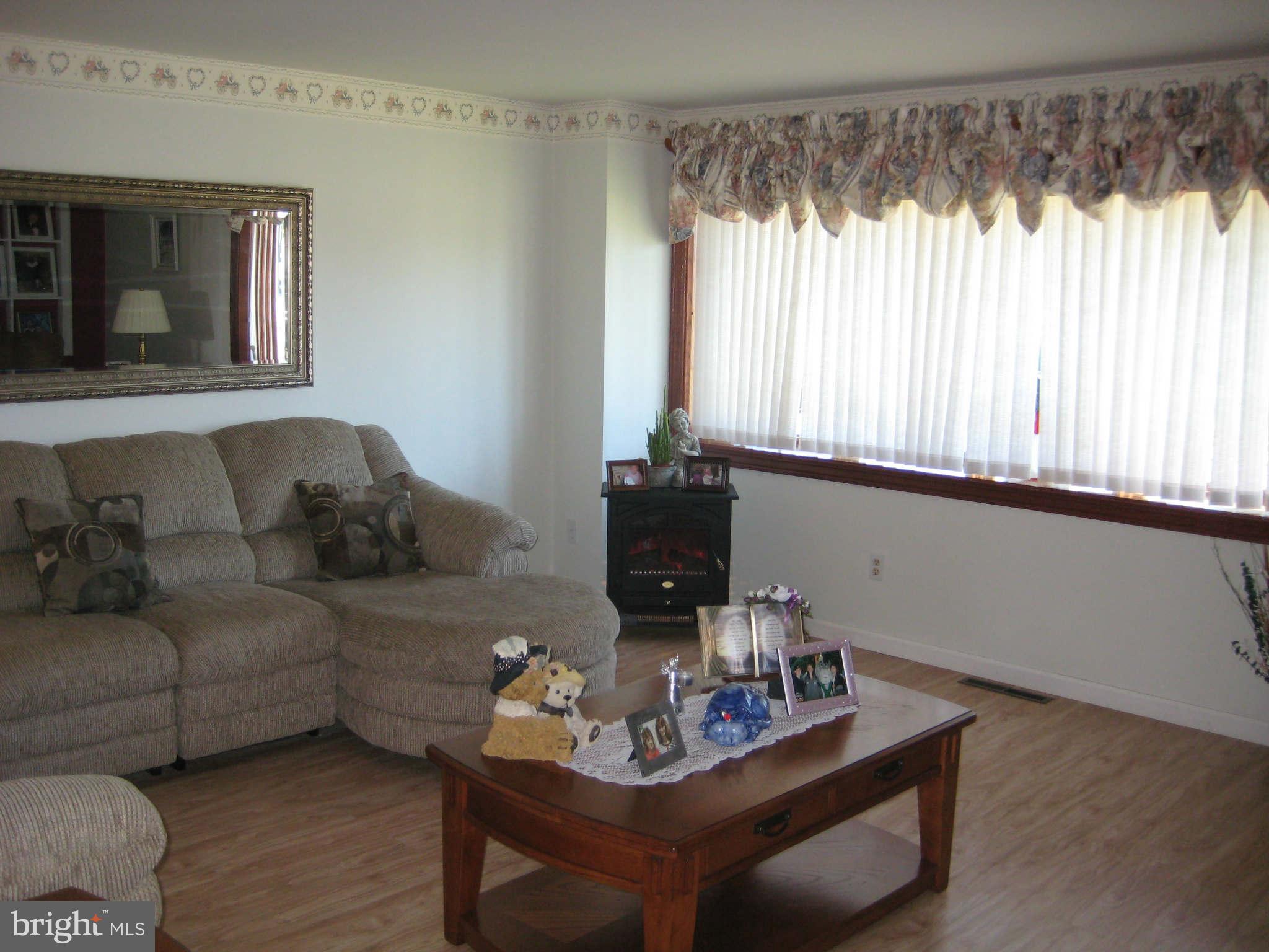 1780 Melbourne Road Baltimore, MD 21222 - Photo 9 of 25 a living room with furniture and a large window