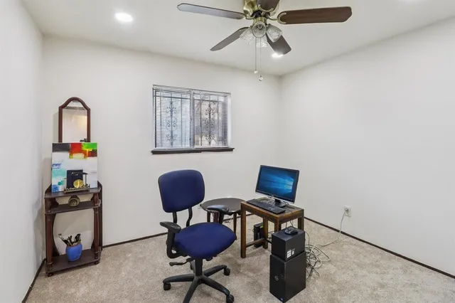 a workspace with furniture and wooden floor