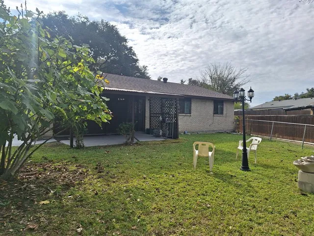 a backyard of a house with lots of green space