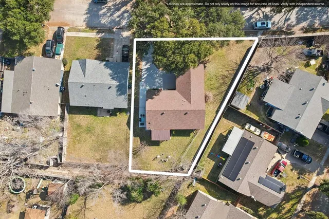 an aerial view of a house with a swimming pool