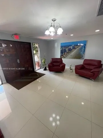 a spacious bathroom with a tub sink and a mirror