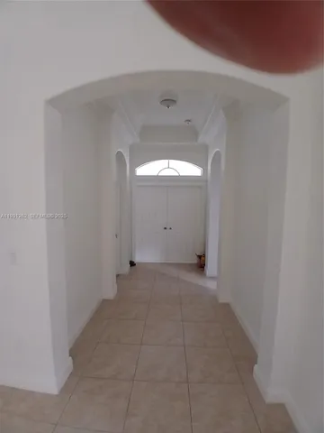 a view of a big room with closet and window