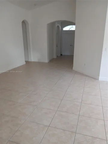 an empty room with a bench