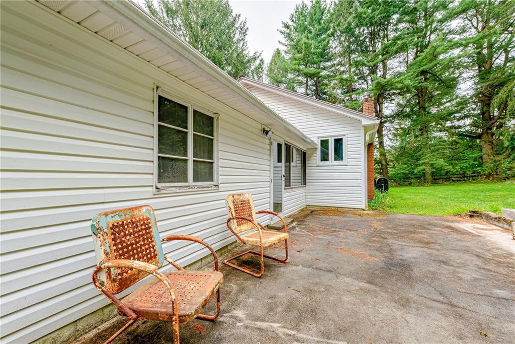27 Matson Road Ligonier, PA 15658 - Photo 19 of 24 a backyard of a house with table and chairs
