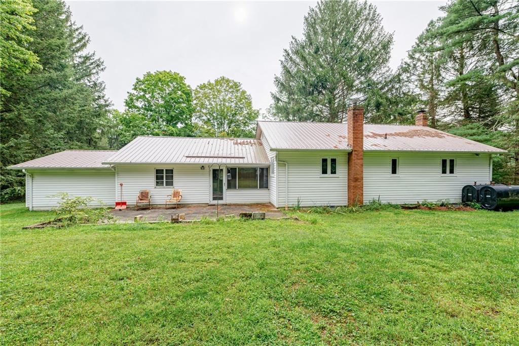 27 Matson Road Ligonier, PA 15658 - Photo 24 of 24 a backyard of a house with table and chairs