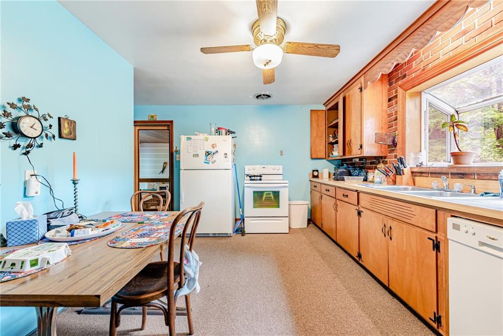 27 Matson Road Ligonier, PA 15658 - Photo 6 of 24 a large kitchen with a table and chairs