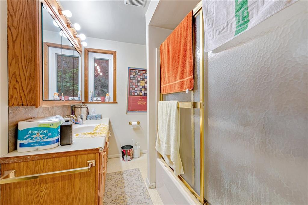27 Matson Road Ligonier, PA 15658 - Photo 8 of 24 a bathroom with a sink a mirror and next to a window